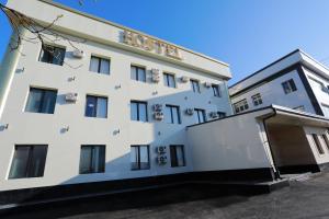 a white building with a sign on it at 1001-NOCH in Tashkent