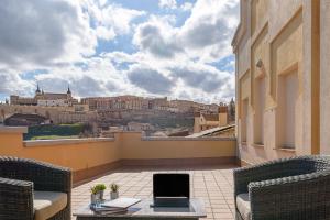 a balcony with a view of the city at Hotel Zentral Mayoral in Toledo