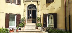 an entrance to a building with stairs and a door at Maison Dolce Vita in Rome