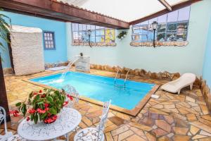 Πισίνα στο ή κοντά στο Pousada Arco-Íris