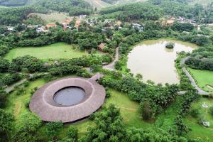 an aerial view of a park with a pond and two lakes at Serena Kim Boi Resort - Hoa Binh in Hòa Bình