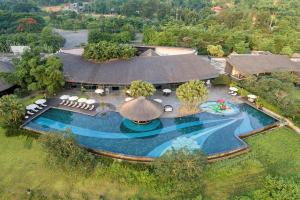 an aerial view of a swimming pool with a resort at Serena Kim Boi Resort - Hoa Binh in Hòa Bình +85 photos