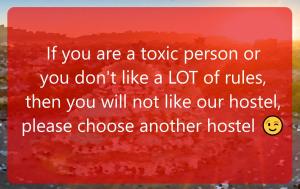 a sign that reads if you are a toxic person or you dont like a lot at "No party & Many rules" Hostel N1 in Sofia
