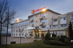 a hotel with a sign on the front of it at Aparthotel Adagio Geneve Saint Genis Pouilly in Thoiry