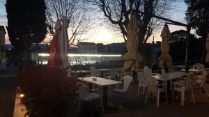 a group of tables and chairs with umbrellas at Mougins Mas lumineux vue sur le village in Mougins