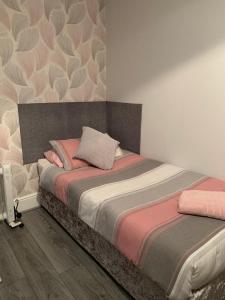 a bedroom with a large bed with a head board at The Prince Alfred in Liverpool