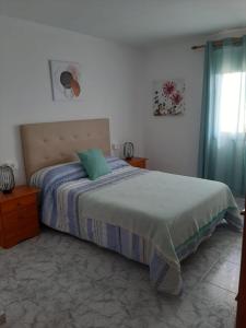Ένα ή περισσότερα κρεβάτια σε δωμάτιο στο Casitas Conchi A