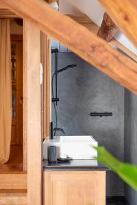 a bathroom with a sink and a shower at Ca'Triz in Borgloon