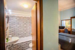 a bathroom with a sink and a toilet in a room at Hotel Martelli in Florence +145 photos