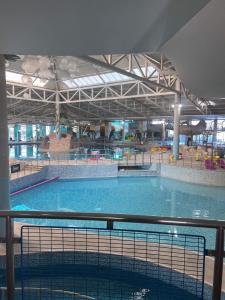 a large swimming pool in a large building at Community Wishes Retreat - Butlins Passes Included in Lincolnshire