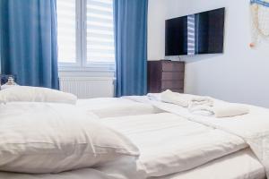 Posteľ alebo postele v izbe v ubytovaní Al-Dom Apartamenty Wiśniowy Ogród z garażem