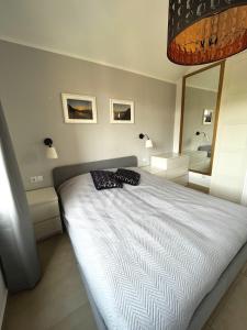 a bedroom with a bed and a mirror at Casa Hugo in Costa Calma