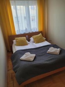 Postel nebo postele na pokoji v ubytování Apartament Zacisze