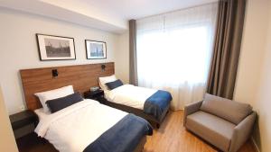 Postel nebo postele na pokoji v ubytování Sleep Port B&B - bezpłatny parking