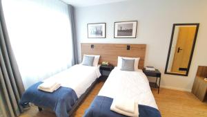 Postel nebo postele na pokoji v ubytování Sleep Port B&B - bezpłatny parking