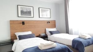 Postel nebo postele na pokoji v ubytování Sleep Port B&B - bezpłatny parking