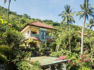 a house in the middle of a garden at Villa 7, Secret Garden, Kerandangan, near Senggigi in Mataram