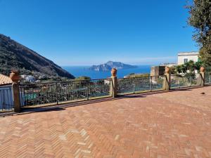 a balcony with a view of the ocean at Casa Gelinda tra Sorrento e Positano in Termini