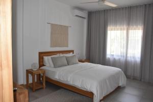 Voodi või voodid majutusasutuse Cap Sud Apartment toas