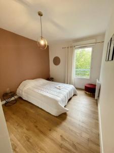 Postel nebo postele na pokoji v ubytování Apartment Cocooning Near La Rochelle