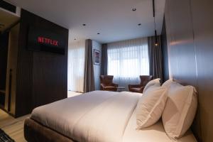 Voodi või voodid majutusasutuse Emery Hotel toas