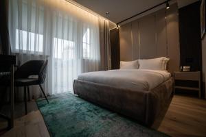 Voodi või voodid majutusasutuse Emery Hotel toas