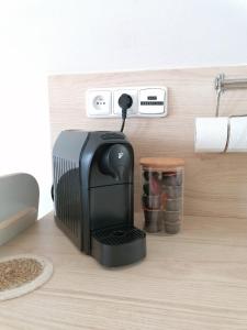 Příslušenství pro přípravu čaje a kávy v ubytování Apartmán Podkroffka