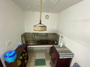 A kitchen or kitchenette at The Sea Shelter Home Stay