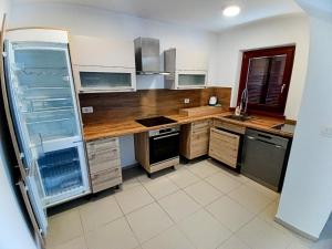 Kuchyň nebo kuchyňský kout v ubytování Friends House Vitovlje