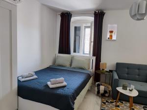 Postel nebo postele na pokoji v ubytování Apartment Augustini