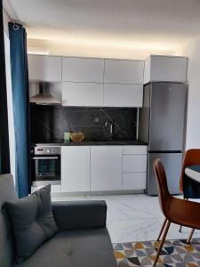 Kuchyň nebo kuchyňský kout v ubytování Apartment Augustini