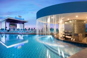 a hotel swimming pool in front of a building at Granada Luxury Beach-Ultra All Inclusive in Avsallar