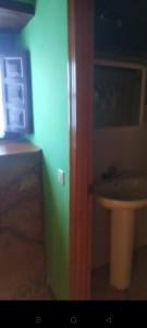 a room with a bathroom with a sink at La casina de castiello in Arriondas