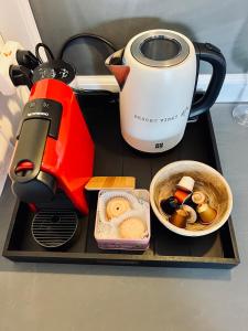 a coffee maker on a tray with food on it at Eilat charming & cozy Studio in Eilat