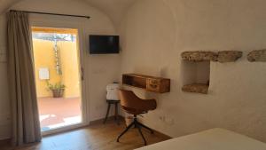 Televisyen dan/atau pusat hiburan di Federico II - Rooms and Breakfast