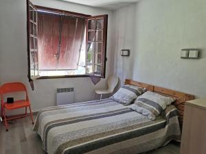 Ένα ή περισσότερα κρεβάτια σε δωμάτιο στο villa plain pied 4 chambres à 100m de la plage