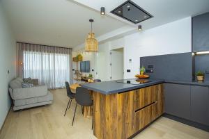 a kitchen with a island in the middle of a room at 138 Miramar Luxury Relax - Alicante Holiday in La Mata