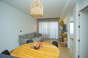 a living room with a table and a couch at 138 Miramar Luxury Relax - Alicante Holiday in La Mata