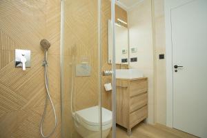 a bathroom with a shower with a toilet and a sink at 138 Miramar Luxury Relax - Alicante Holiday in La Mata +37 photos