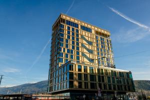 a tall building with a lot of windows at Motel One Innsbruck in Innsbruck