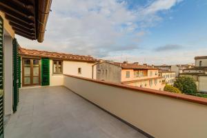 a balcony with a view of the city at Palazzo Mannaioni Suites in Florence