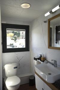 a bathroom with a toilet and a sink at ALMALO Floating House - Casa Galleggiante in Procida