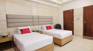 Postel nebo postele na pokoji v ubytování Hotel Afford Inn + 21 fotografií