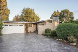 a house with a driveway and a garage at 3874 Mission Fields home in Carmel