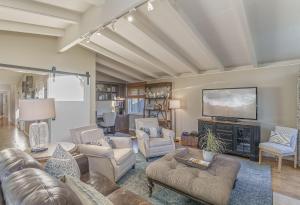 a living room with a couch and a tv at 3874 Mission Fields home in Carmel