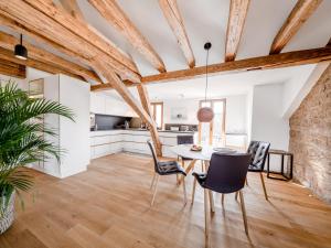 a kitchen and dining room with a table and chairs at Alte Schule Tiefenbach in Tiefenbach