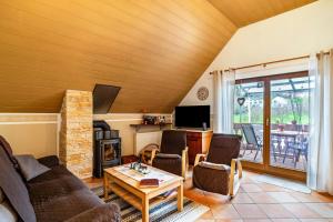 a living room with a couch and a table at Burgblick in Lauf