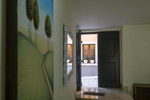 a hallway with a door leading to a patio at Laetitia Guesthouse in Sepino
