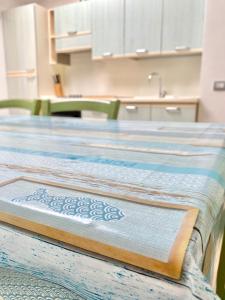 a table with a blue and white table cloth on it at Berenice in Rio Marina