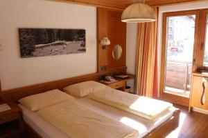 Postel nebo postele na pokoji v ubytování Hotel Landle